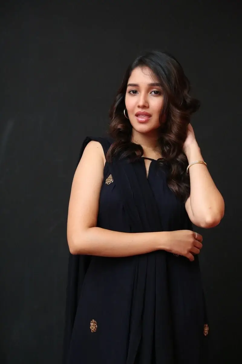 Actress Anikha Surendran in Black Dress at Butta Bomma Movie Trailer Launch